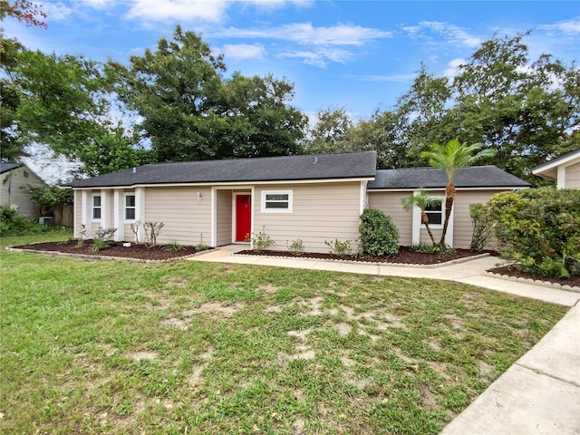 single story home featuring a front lawn