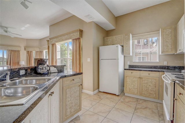 kitchen featuring white appliances, light tile patterned floors, ceiling fan, sink, and light brown cabinets