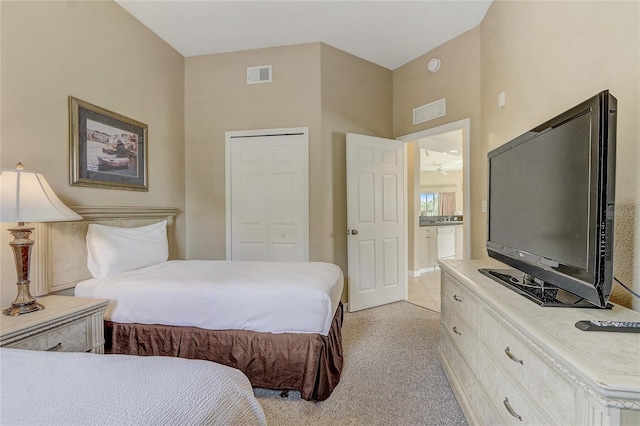 carpeted bedroom with a closet