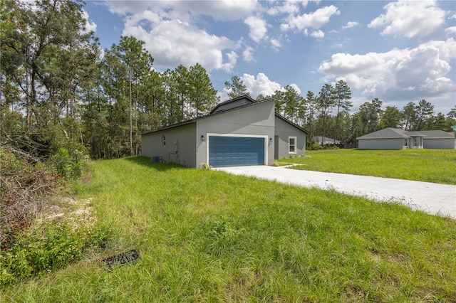 exterior space with a garage and a yard