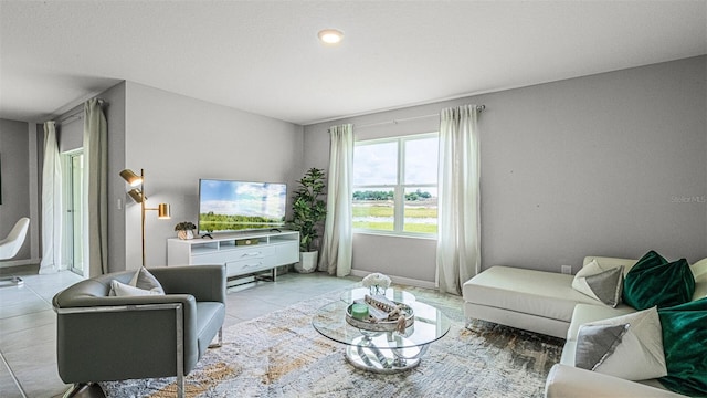 living room featuring light tile patterned flooring