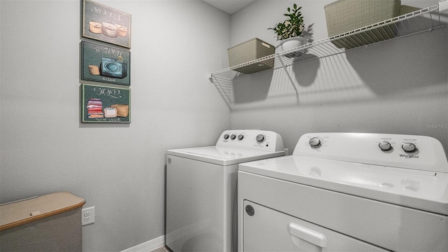 clothes washing area featuring washer and dryer