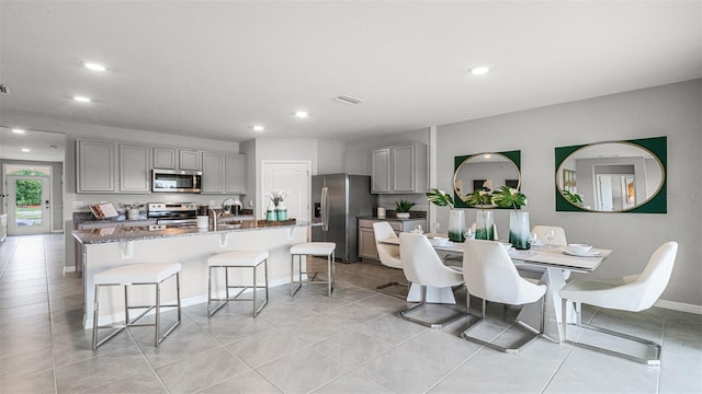 3907 Botancial Ct, Sanford, FL 32773 - dining space with recessed lighting, light tile patterned flooring, and baseboards