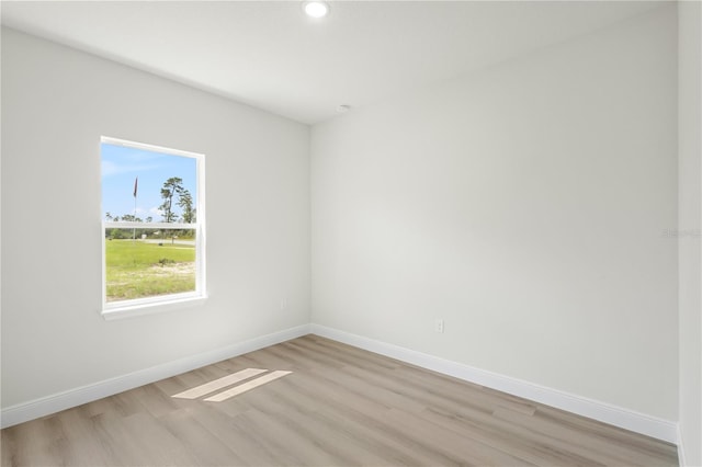 unfurnished room with light hardwood / wood-style floors