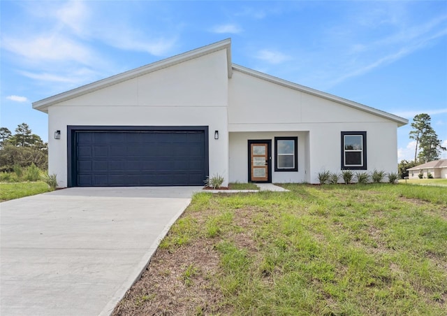 view of front facade with a front yard and a garage