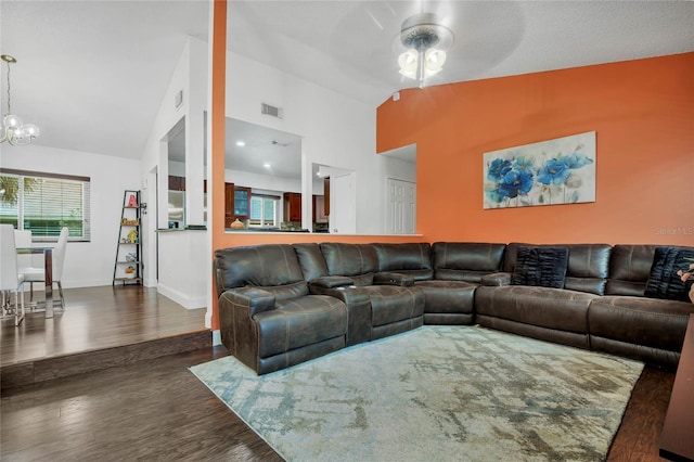 701 Castlewood Dr, Winter Springs, FL 32708 - living room with dark wood-type flooring, ceiling fan with notable chandelier, and high vaulted ceiling