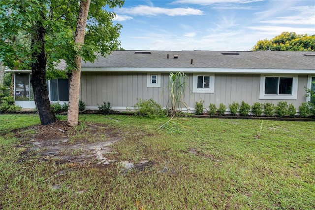 701 Castlewood Dr, Winter Springs, FL 32708 - rear view of house with a sunroom and a lawn