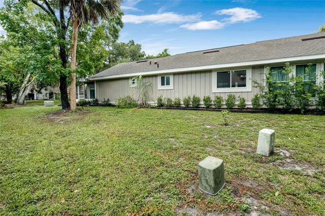 back of house with a yard