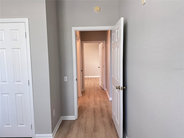 corridor featuring light hardwood / wood-style flooring