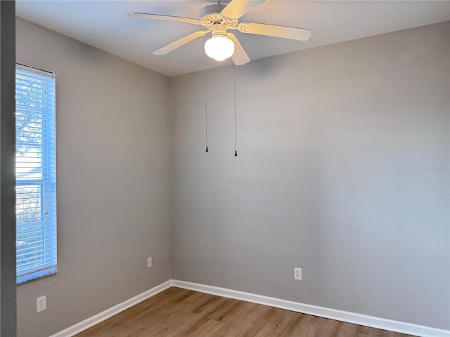 spare room featuring ceiling fan and wood-type flooring