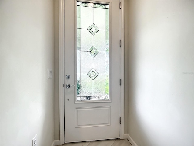 entryway featuring baseboards