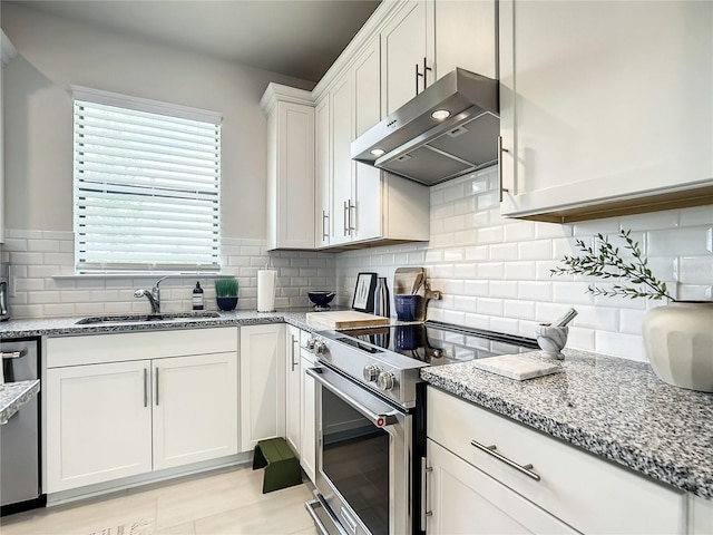 kitchen with backsplash, appliances with stainless steel finishes, white cabinetry, a sink, and under cabinet range hood