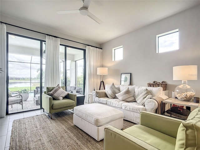 tiled living room with a ceiling fan