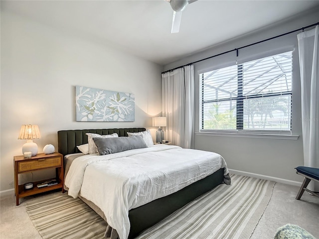 bedroom featuring carpet floors, ceiling fan, and baseboards