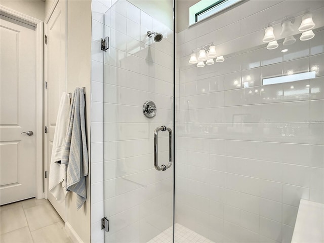 bathroom featuring a shower stall and tile patterned floors