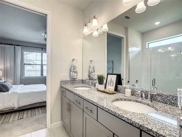 full bath featuring visible vents, a sink, a shower stall, and ensuite bath