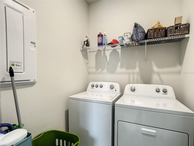 washroom with laundry area and washer and dryer