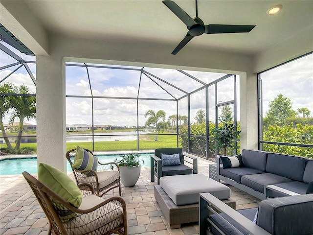 view of patio with glass enclosure, a water view, an outdoor pool, and an outdoor hangout area