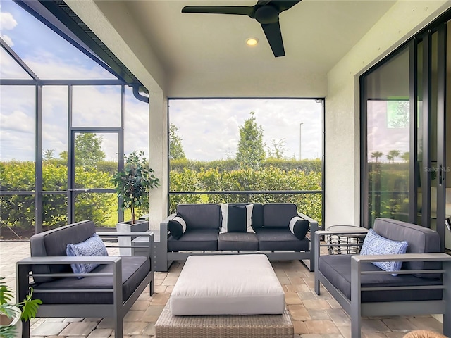 sunroom with a ceiling fan