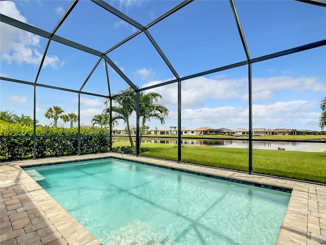 outdoor pool with a water view, a lanai, and a lawn