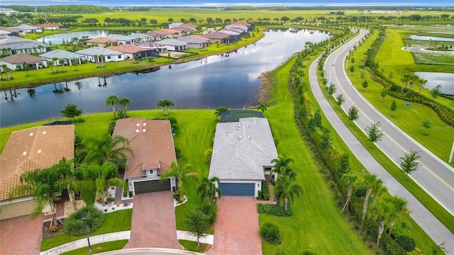 bird's eye view featuring a water view and a residential view