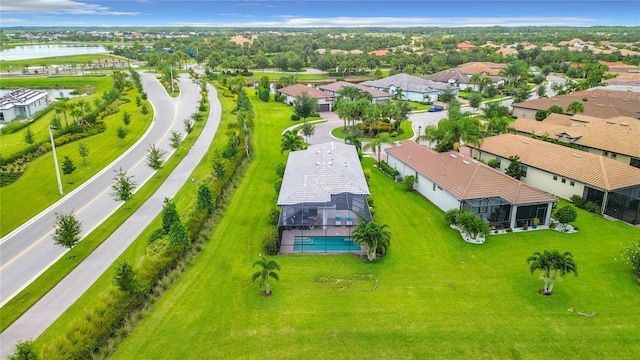 bird's eye view featuring a water view and a residential view