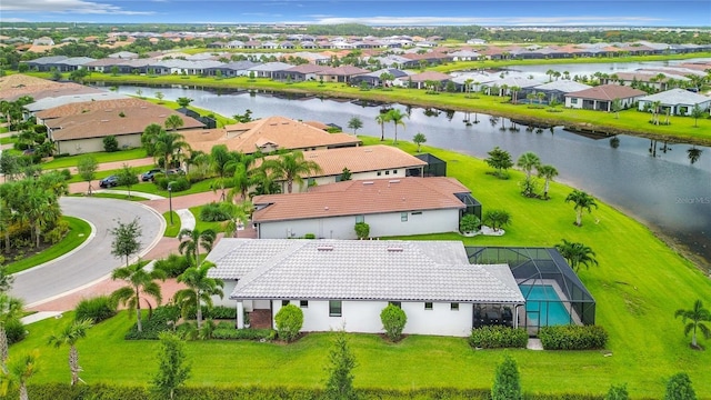 bird's eye view featuring a residential view and a water view