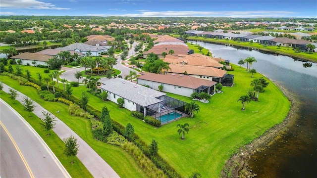 birds eye view of property featuring a residential view and a water view