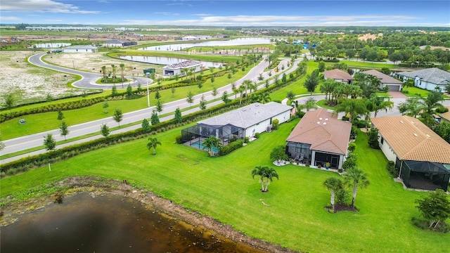 bird's eye view with a water view and a residential view