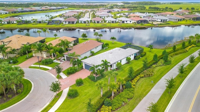 bird's eye view with a water view and a residential view