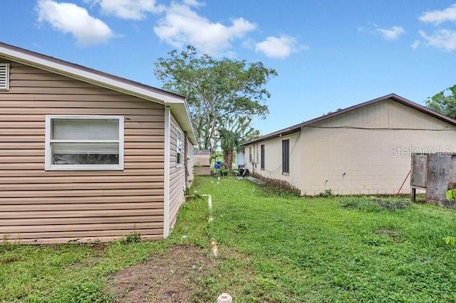 view of home's exterior featuring a lawn