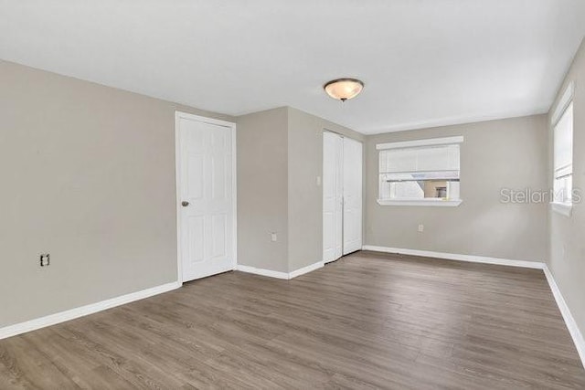 empty room featuring dark wood-type flooring