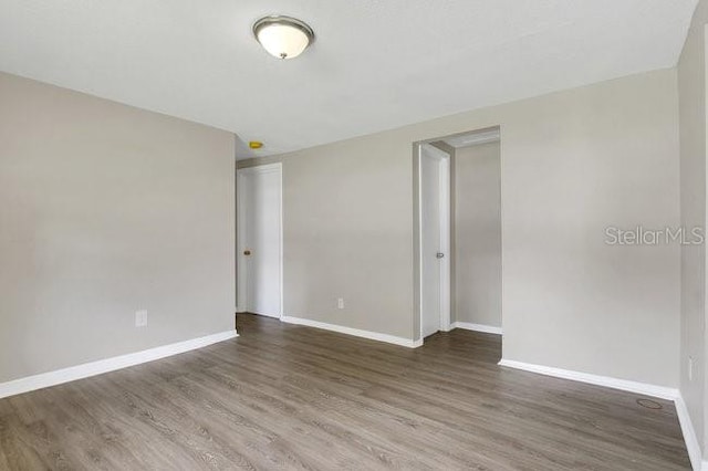 empty room featuring hardwood / wood-style flooring