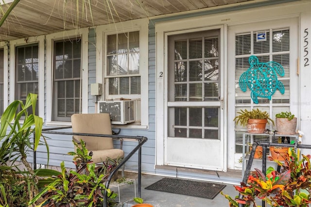 entrance to property featuring cooling unit