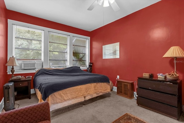 bedroom with cooling unit, a ceiling fan, and light colored carpet