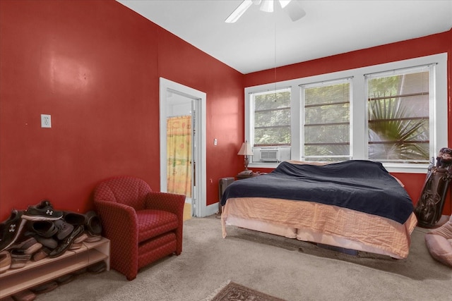 bedroom featuring carpet, cooling unit, and ceiling fan