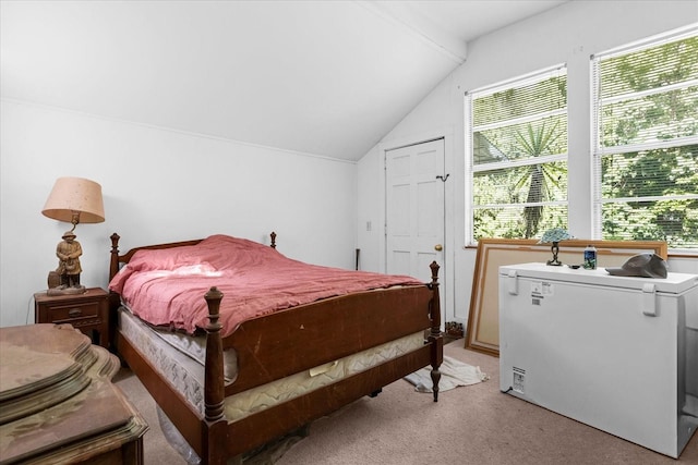 bedroom featuring refrigerator, light colored carpet, and lofted ceiling with beams