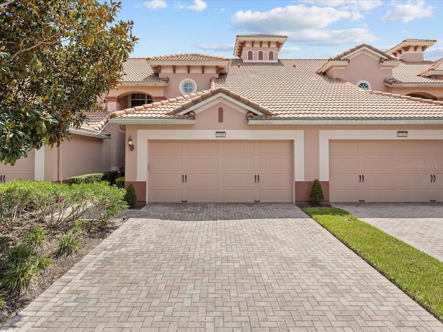 mediterranean / spanish-style house featuring a garage