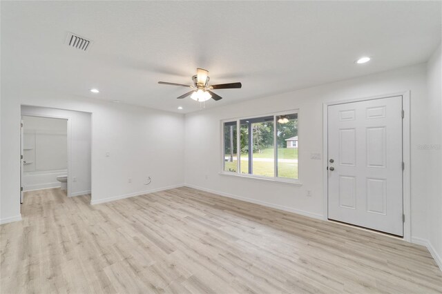 foyer entrance with light hardwood / wood-style flooring and ceiling fan