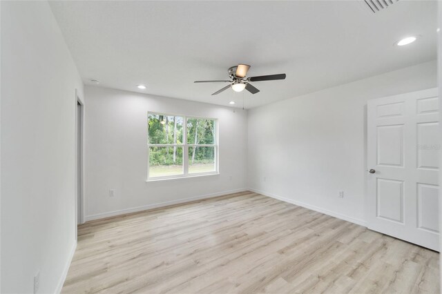 unfurnished room with light hardwood / wood-style flooring and ceiling fan