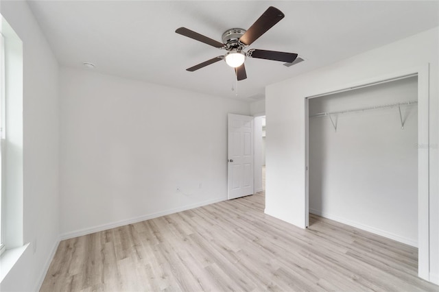 unfurnished bedroom featuring a closet, ceiling fan, and light wood-type flooring