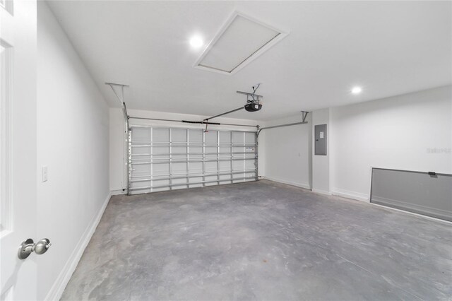 garage with electric panel and a garage door opener