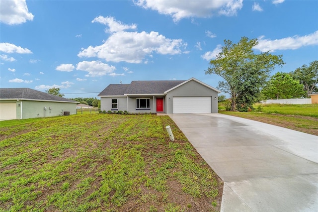 ranch-style house featuring a garage and a front yard