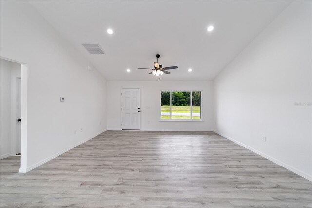 empty room with light wood-type flooring and ceiling fan