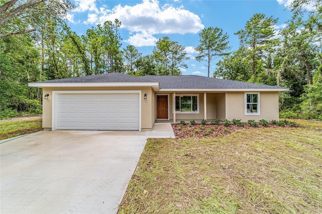 ranch-style home featuring a garage and a front lawn