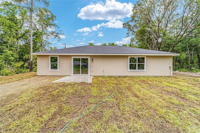 ranch-style home with a patio and a front yard