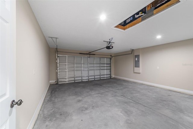 garage with electric panel and a garage door opener