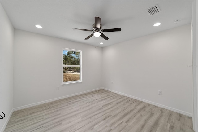 unfurnished room with light wood-type flooring and ceiling fan