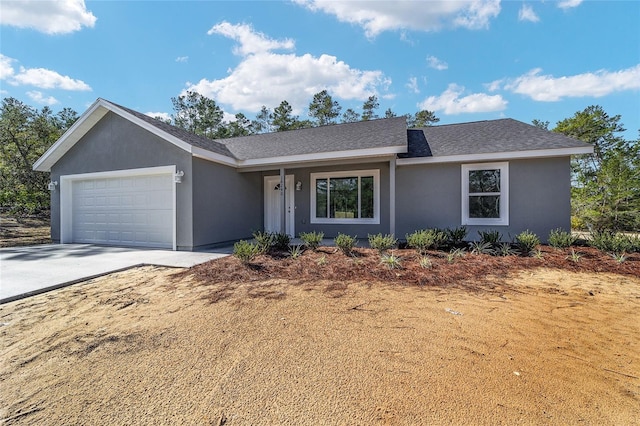 ranch-style home featuring a garage