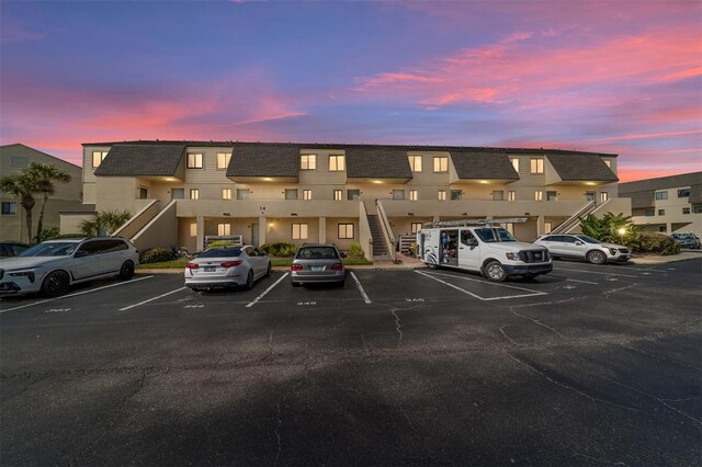 view of outdoor building at dusk